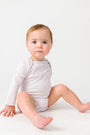Baby Orchid Prayer Pocket Bodysuit | Long Sleeve